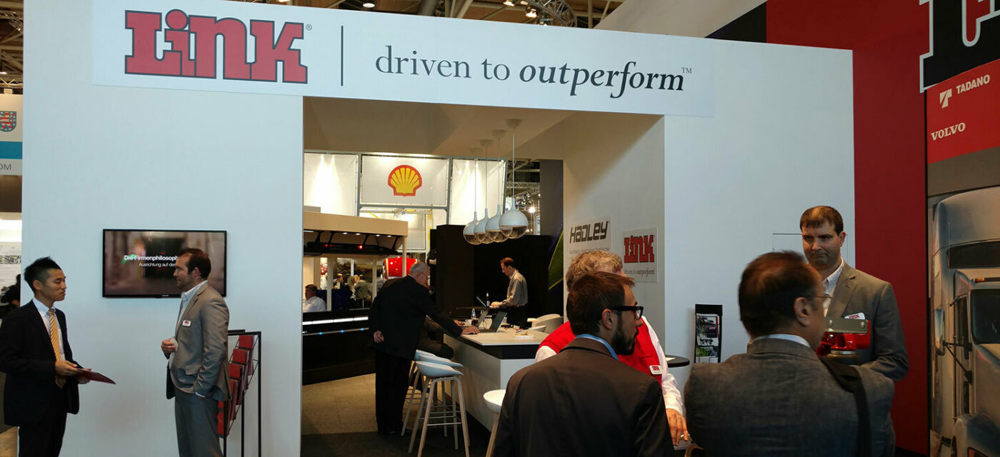 Archway with Link banner along with Link sales representatives at 2016 Commercial Vehicles Show