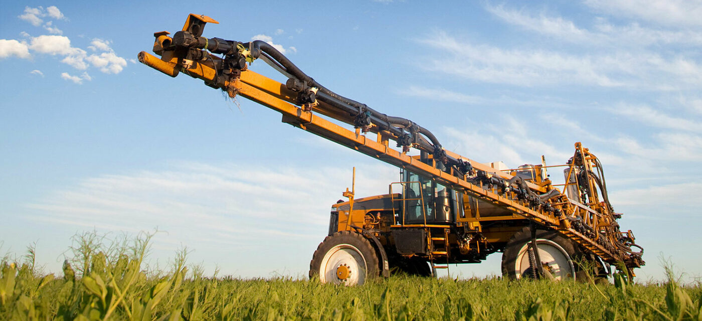 A field sprayer in a fam field equipped with a cab suspension