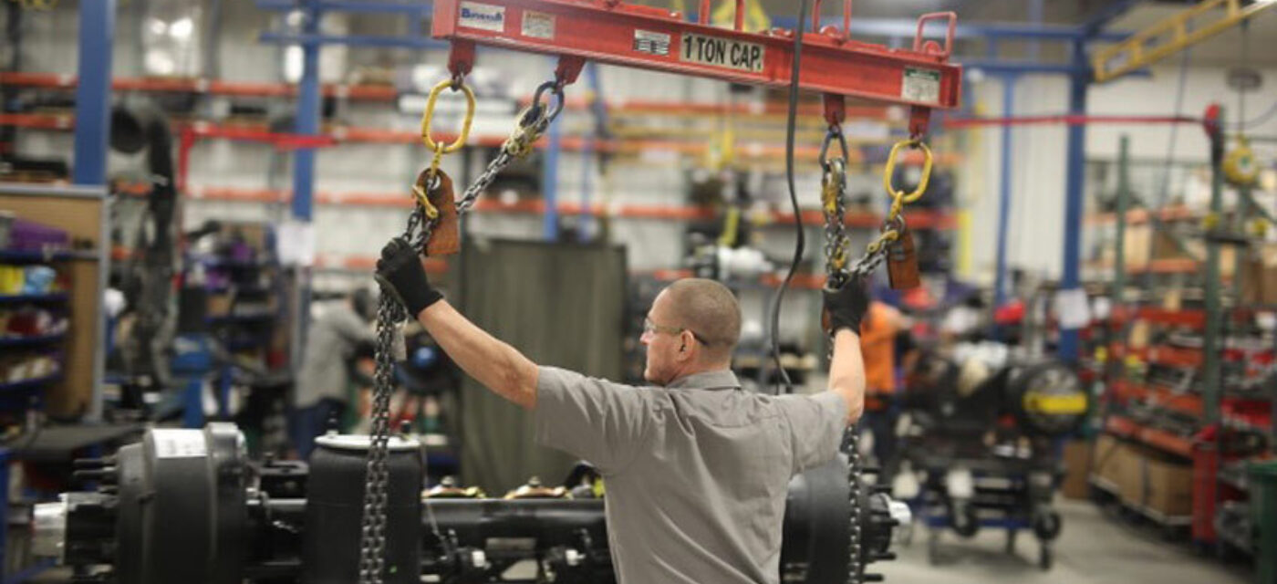 A man moving an auxiliary suspension
