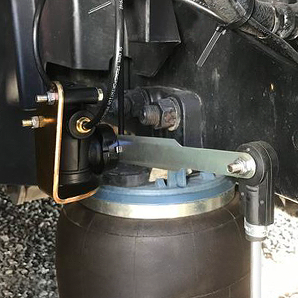 600 Series Cab Suspension Leveling Valve installed above airbag