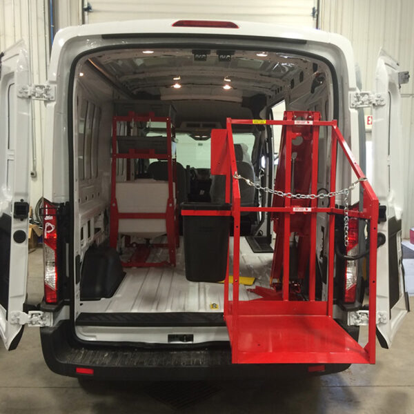 The CL400 machine lift in the process of lowering outside the vehicle.