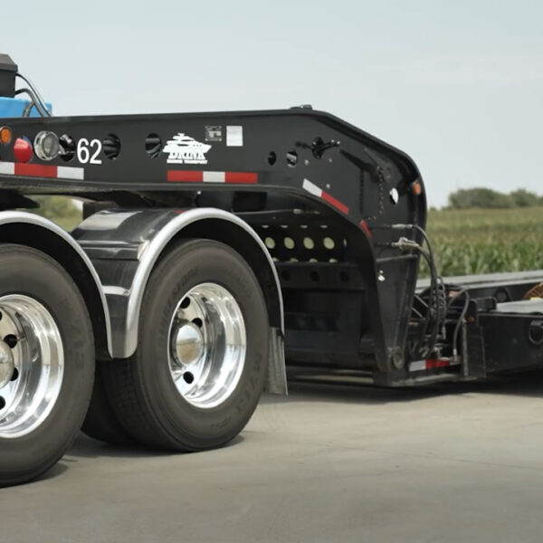 A lowboy trailer lifted above ride-height with SmartValve.