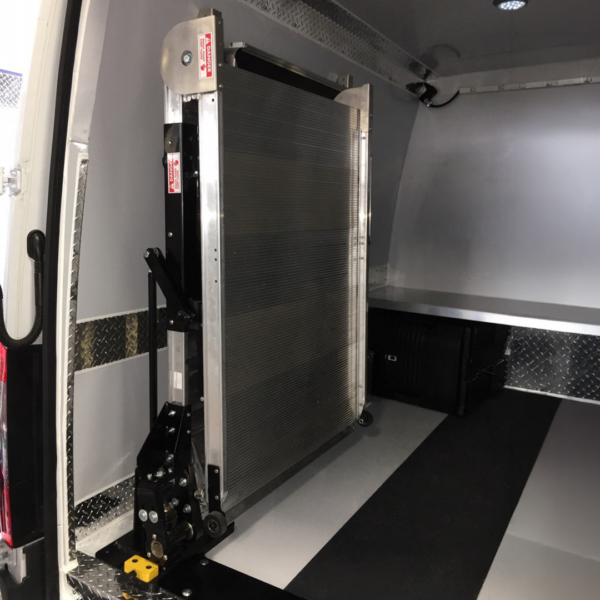 The LSR90 Swivel Ramp in the rear stored position in the cargo van