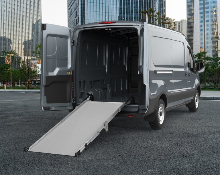 Ford Transit with LB20 Loading Ramp extended out of open rear doors.
