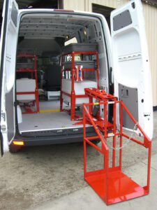 CL400 machine lift pivoted outside cargo van.