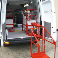 CL400 machine lift pivoted outside cargo van.