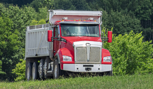 Dump Truck with two Steerable Lift Axles installed