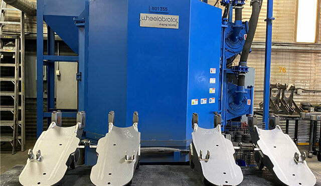 Parts in front of a Wheelabrator unit