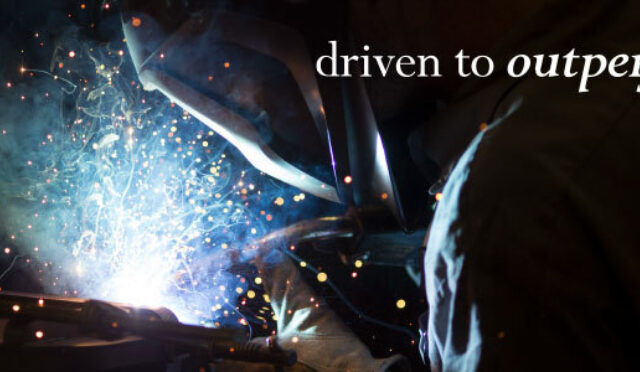 A welder welding with sparks flying, "driven to outperform" overlaid
