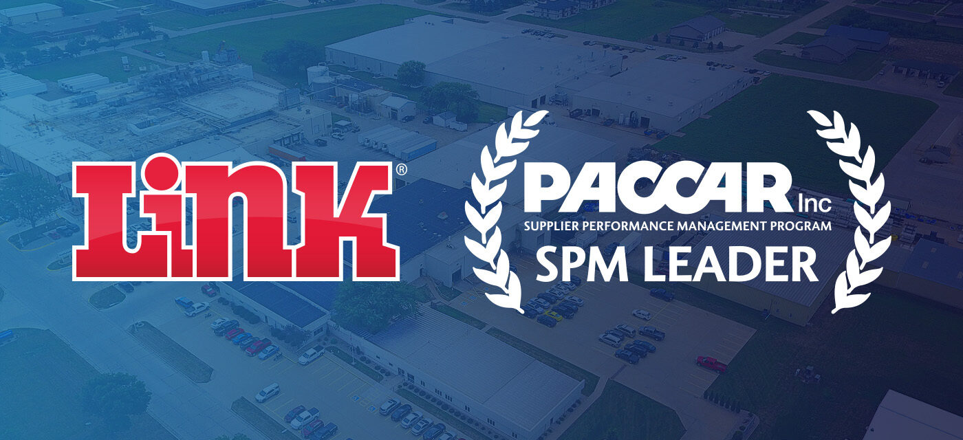Link logo and PACCAR SPM Leader Award overlayed on photo of Link Mfg's Sioux Center Campus