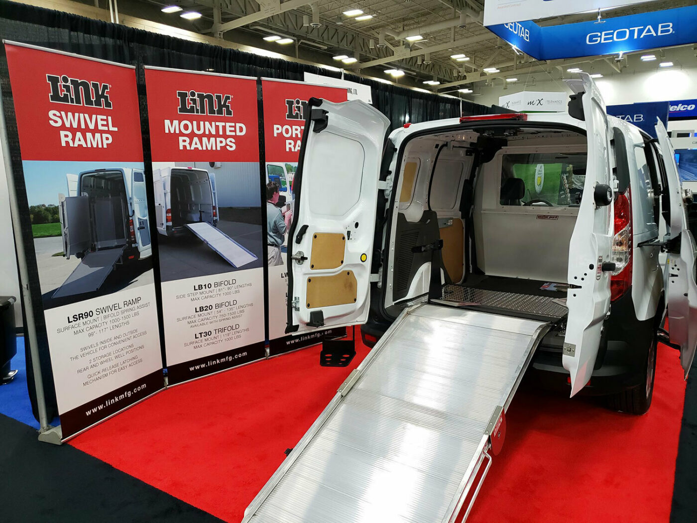 Nafa 2019 booth with a cargo van featuring a Link Mounted Ramp