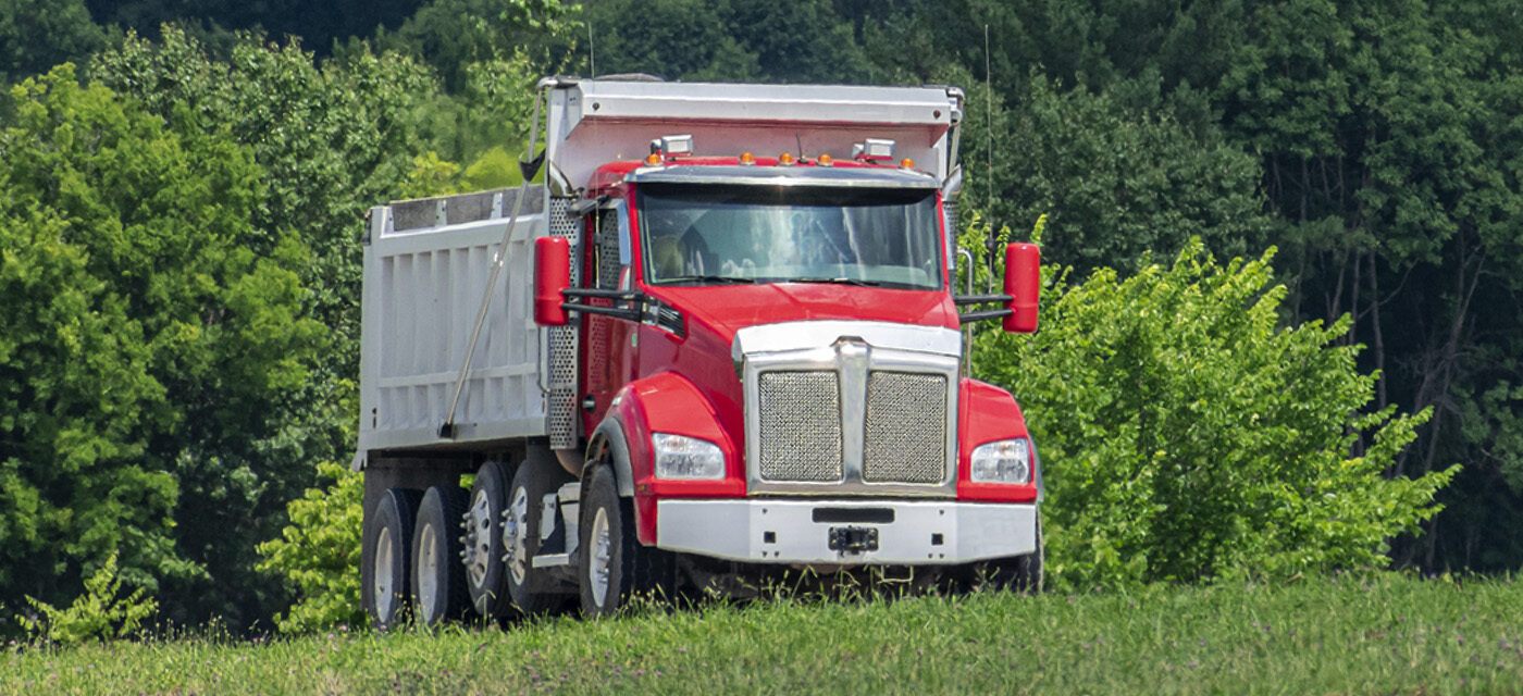 Dump Truck with two Steerable Lift Axles installed