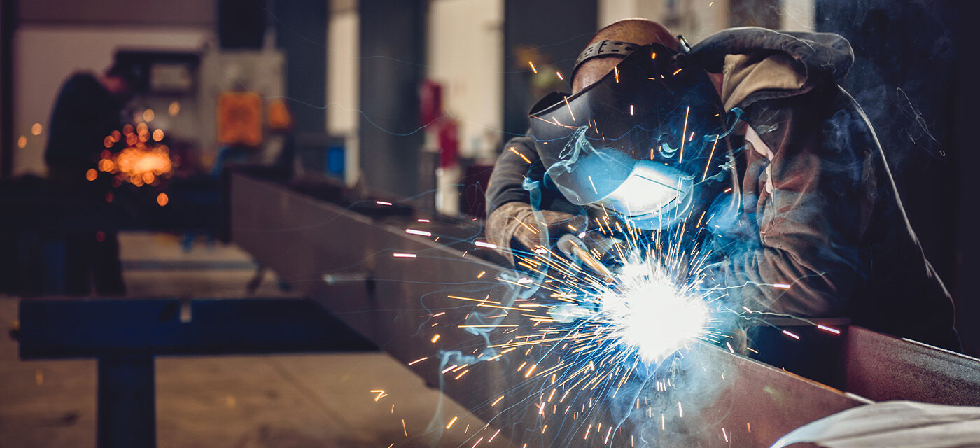 Man welding on frame rail