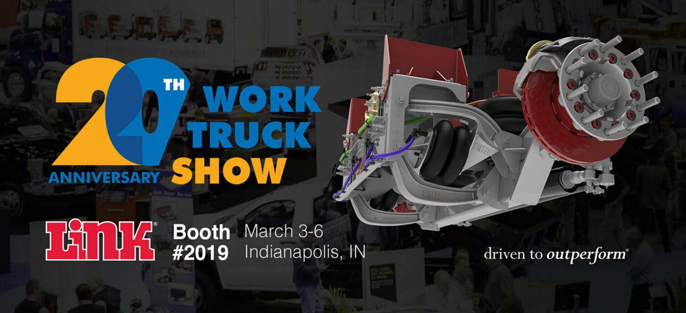 The expo floor of the NTEA Work Truck Show with the show logo, Link's logo, and a lift axle rendering overlaid