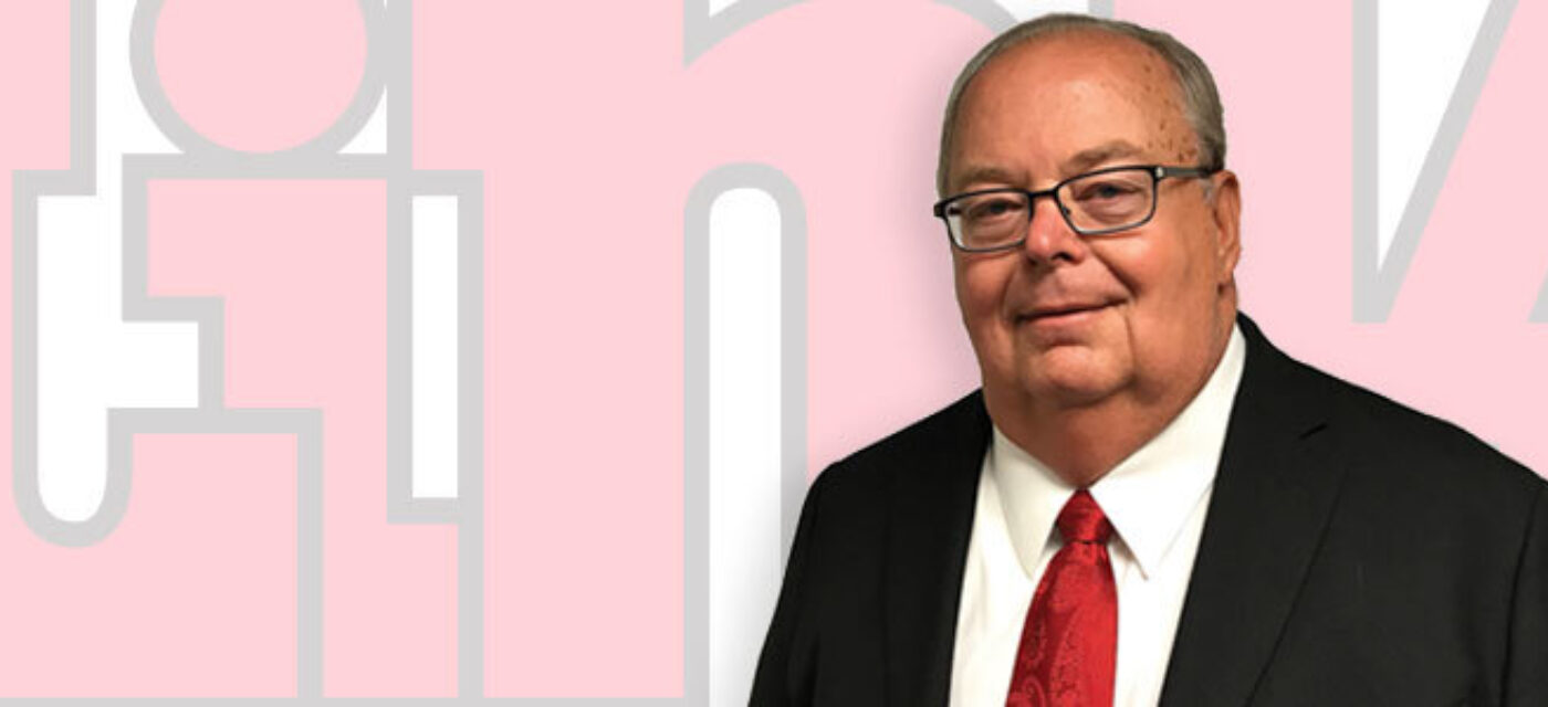 A phot of Denny Michels in front of a Link Logo