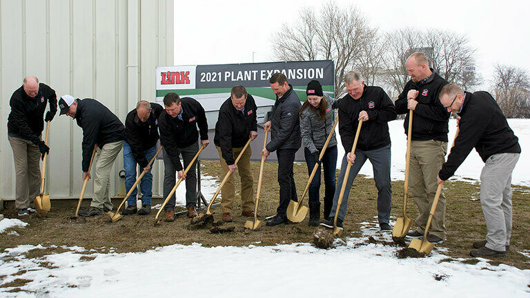 Link's leadership team with Sioux Center, IA's mayor, using gold shovels to break the ground on Link's plant 4 building project