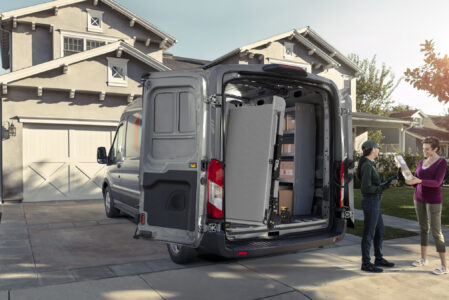 A Link Swivel ramp swiveled 90 degrees outside a Ford Transit Delivery Van.