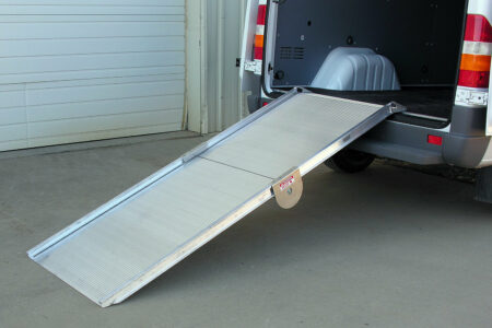 A Link portable ramp deployed from the back of a cargo van