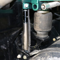 A ROI Cabmate installed on a green Kenworth semi-truck.