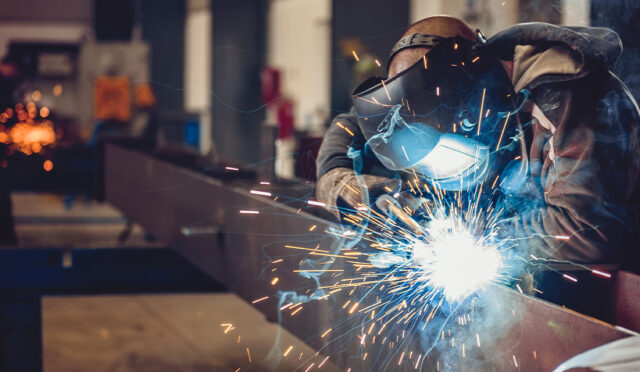 Man welding on frame rail