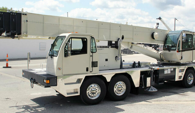 White crane truck in a parking lot