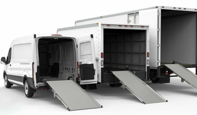 Three cargo vehicles with ramps deployed