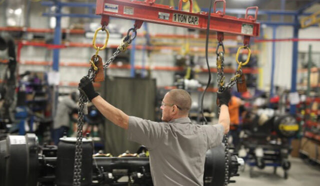 A man moving an auxiliary suspension